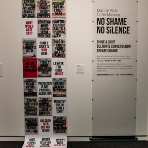 Under Reported. This wall was built using an early 20th century proofing press in Foxton. It showcases headlines submitted by survivors of family violence and abuse by the family court system of New Zealand.